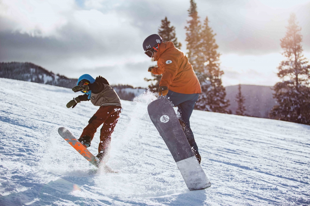 AASI team member Chris Rogers teaches a kids snowboard lesson